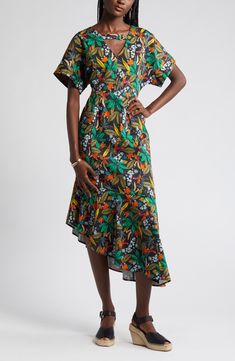 A gleaming goldtone detail bridges the cutout strap of a vivid floral dress accented by a fluttery asymmetric hem. 52 1/2" length V-neck Short sleeves Lined 100% cotton Machine wash, line dry Imported Asymmetrical Floral Print Maxi Dress For Evening, Evening Floral Print Midi Dress With Asymmetrical Hem, Party Dress With Floral Print And High-low Hem, Asymmetrical Floral Print Dress For Garden Party, Asymmetrical Floral Dress For Garden Party, Short Sleeve Asymmetrical Dress For Summer Cocktail, Short Sleeve Asymmetrical Summer Cocktail Dress, Summer Cocktail Asymmetrical Dress With Short Sleeves, Short Sleeve Asymmetrical Cocktail Dress For Summer