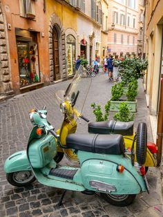 a moped parked on the side of a street