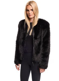 Add an edgy touch to your winter collection with this sleek faux fur jacket. The minimalist silhouette, paired with the plush texture of the faux fur, creates a contemporary yet chic look. The classic color makes it a versatile addition, effortlessly transitioning from casual daytime outings to evening affairs. Featuring a zip-front closure with subtle leather accents, and spandex thumbhole cuffs,this jacket combines urban flair with luxurious comfort. Whether paired with jeans or styled over a Winter Faux Fur Coat With Zipper Closure, Chic Winter Fur Coat With Zipper Closure, Chic Faux Fur Outerwear With Zipper, Chic Faux Fur Outerwear With Zipper Closure, Plush Coat, Sherpa Jacket, Leather Accents, Free Fabric, Faux Fur Jacket