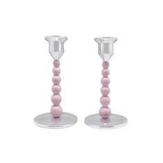 two glass candlesticks with pink beads on each one and a clear holder for the candle