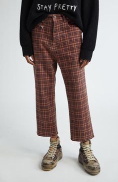 Chris Leba's rebellious vision breaks through in the rock 'n' roll–inspired silhouette of these cropped pants patterned in autumnal-hued plaid. Zip fly with button closure Five-pocket style 98% cotton, 2% polyurethane Machine wash, line dry Imported Designer Clothing Plaid Tuxedo, Checkered Pants, Tuxedo Pants, Pants Pattern, Auburn, Straight Leg Pants, Cropped Pants, Bottoms Pants, The Rock