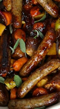 sausages, carrots and other vegetables in a bowl