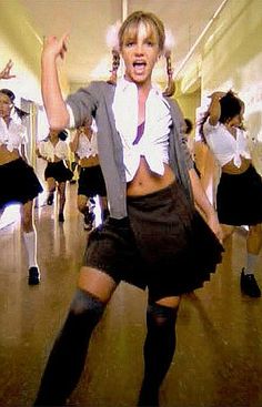 a group of young women dancing in school uniforms