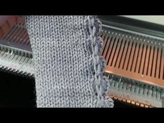 a close up of a piece of cloth on a conveyor belt with metal grates