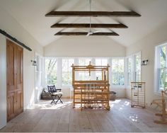 a room with wooden floors and white walls