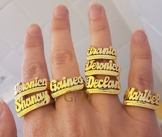 A name ring is a unique and personal way to express your identity and style. Whether you want to wear your own name, a loved one's name, or a meaningful word, you can customize your ring with up to 10 letters in a beautiful script font. The ring is made of high-quality sterling silver with a choice of gold or rose gold overlay for a stunning finish. The ring comes in a lovely gift box and is available in different sizes. A name ring is a perfect gift for yourself or someone special on any occasi Custom Nameplate Rings For Promise, Silver Nameplate Ring With Custom Name, Custom Name Nameplate Ring For Promise, Custom Nameplate Ring For Promise, Promise Ring With Custom Nameplate, Customized Nameplate Rings For Anniversary, Custom Name Plate Ring For Promise, Engraved Nameplate Ring For Promise, Customizable Nameplate Promise Ring