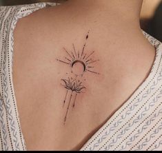 a woman's upper back tattoo with the sun and moon on her left shoulder