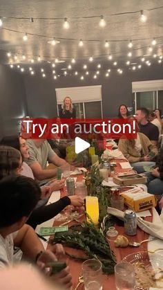 a group of people sitting around a table with food and drinks in front of them