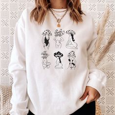 Unisex mushroom girls crewneck sweatshirt for men and women. SIZING * FOR AN OVERSIZED FIT, SELECT 1-2 SIZES UP FROM YOUR NORMAL SIZE * Sizing is unisex so runs like men's, though not overly large * A pre-shrunk, classic fit sweater that's made with air-jet spun yarn for a soft feel and reduced pilling. * Fuzzy fleece, warm lining. Details: * 50% cotton, 50% polyester * Pre-shrunk * Classic fit * 1x1 athletic rib knit collar with spandex * Air-jet spun yarn with a soft feel and reduced pilling Casual Crew Neck Sweatshirt With Mushroom Print, Cotton Crew Neck Sweatshirt With Mushroom Print, Relaxed Fit Fall Tops With Mushroom Print, Relaxed Fit Mushroom Print Top For Fall, Relaxed Fit Top With Mushroom Print For Fall, Casual Long Sleeve Top With Mushroom Design, Winter Cotton Tops With Mushroom Print, Mushroom Print Tops For Fall Streetwear, Cotton Sweatshirt With Mushroom Print