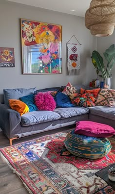 a living room filled with lots of colorful pillows