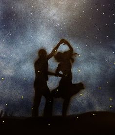 two people are dancing under the stars in the sky