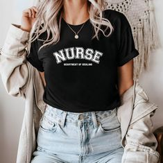 🌟 Welcome to Comzy Closet! 🌟 Do you like this "Nurse: Heartbeat of Healing" t-shirt?  We are working hard, to get the best tees in town for YOU! Support our small business and buy our cozy t-shirts! You won't regret!  Step into a world of your unique style add a touch of individuality to your wardrobe with our collection of custom design printed tees!  🎨 Express Yourself: From vibrant graphics to intricate patterns, our designs are crafted to ignite your imagination and make a statement where Casual Relaxed Fit Nursing T-shirt, Nursing Graphic Tee With Short Sleeves, Nursing Cotton T-shirt With Letter Print, Pre-shrunk Crew Neck Nursing Shirt, Casual Nursing Shirt With Short Sleeves, Casual Short Sleeve Nursing Shirt, Casual Cotton T-shirt For Nursing, Cotton Nursing T-shirt Relaxed Fit, Relaxed Fit Cotton T-shirt For Nursing