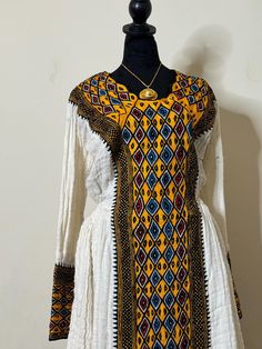 Axsum fetil dress Ethiopian.Ertirean dress/habesha kemis/ 100%cotton/ሙሉ በሙሉ የእጅ ጥልፍ / full love ❤️ with our gorgeous authentional Ethiopian weavers/ሽማኔ የተሰራ/ it is hand embroidered by traditional embroidery artisans using Ethiopian cotton the detailing on these dress            100%handwoven/በእጅ የተሰራ/ውብ              Includes: netsela.mekeneti Ethiopian Traditional Dress, Habesha Kemis, Dress 100, Traditional Dresses, Festival Season, Hand Embroidered, Favorite Outfit, Hand Weaving, Art Collection