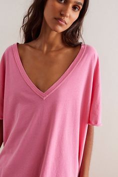 Our favorite wear-everywhere tee from our We The Free collection, now featuring a deep V-neckline. **Fit:** Boxy, slightly oversized fit **Features:** Soft cotton fabrication, deep V-neckline, dropped shoulders, raw-edge seaming throughout **Why We ❤ It:** Perfect with your favorite jeans or effortless layered with loungewear, you’ll be reaching for this tee with every ‘fit. | We The Free Nina V-Neck Tee at Free People in Pink, Size: L Raw Edge, V Neck Tee, Fashion Tees, Favorite Jeans, Tee Shop, Baseball Tee, Boho Outfits, Oversized Fits, Chambray