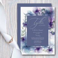 a wedding card with watercolor flowers on it