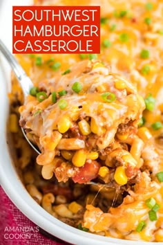 a spoon full of mexican casserole with meat and vegetables on it, ready to be eaten