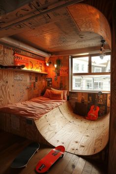 a skateboard is laying on the floor in a room with wood paneled walls