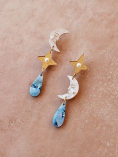 Asymmetric drop earrings with moon, star and teardrop pendants. Playful statement stud earrings, handmade in the U.K. Jewellery by Wolf & Moon. Mother Of Pearl Meaning, Playful Jewelry, Celestial Earrings, Pearl Details, Hoop Charms, Wolf Moon, Cotton Gifts, Zodiac Necklaces, Moon Jewelry