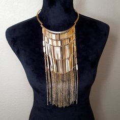 This Golden Metal Bib Fringe Drop Chocker Necklace Is The Perfect One For Parties And Music Festivals. It Will Make You Stand Out In A Crowd Of Hundreds. Bohemian Gold-tone Necklaces For Party, Gold Bib Necklace With Adjustable Chain For Party, Gold Bib Necklace With Chain For Gift, Gold Bib Necklace As A Gift, Gold Layered Party Necklace, Gold Metal Dangle Layered Necklace, Gold Dangle Chain Choker, Gold Metal Bib Necklace With Adjustable Chain, Gold Metal Layered Necklace For Costume Jewelry