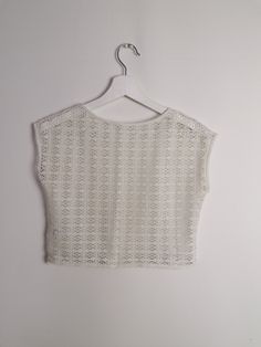 Beautiful off-white sheer crochet knit crop top, fringed hem/ Excellent vintage condition. Would fit size XS. Model wears size 8-10 UK, S-M US, is 160 cm tall and weighs 54 kg. All of our items are freshly laundered with quality detergents and fabric softeners, absolutely ready to wear the moment you receive them! Keep in mind, this item is vintage and subtle signs of passing time may be present, adding to its character and making it even more worthy of your love. For more info, additional photo 80s Festival, Hippie Crochet, Crochet Crop, Crochet Crop Top, Boho Print, Knit Crop Top, Knit Crop, Winter Knits, Sheer Blouse