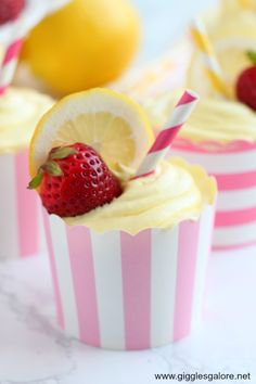 cupcakes with strawberries and lemon slices on the top are ready to be eaten