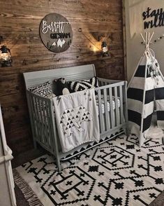 a baby's room decorated in black and white