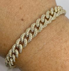 "Beautiful Pave Link Bracelet Yellow Gold set with sparkling diamonds.  Feels nice and solid 22.72 grams of solid gold.  The back of the bracelet is smooth shiny gold. This bracelet is like a buy one get one free.  Lol. You can wear the diamond side or flip the bracelet over and wear on the plain gold side on more casual days.  Measures 8mm width.  The lock is nice and secure with safety latch.  The diamonds are set nice and smooth.  Excellent craftsmanship.  7\" length.   Genuine earth mined round brilliant cut diamonds  Total weight: 3.85 Carats Clarity: SI/ I Color: G All shiny diamonds, no cloudy or yellowish stones  Solid 14K Gold 22.72 grams  Comes with gift box * We have been in the wholesale Jewelry business for over 30 years serving the community at the same location.  All diamond Luxury Yellow Gold Chain Bracelet With Single Cut Diamonds, Gold Diamond Cut Cuban Link Bracelet, Yellow Gold Diamond Cuban Link Bracelets, Luxury Iced Out Yellow Gold Diamond Bracelet, Diamond Cuban Link Bracelet For Anniversary, Gold Cuban Link Bracelets With Diamond Accents, Diamond Jubilee Bracelet In Gold, Gold Diamond Cut Bracelet With Dazzling Style, Gold Diamond Cut Dazzling Bracelet