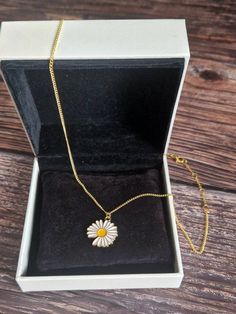 Gold Daisy necklace. All findings and chain used are also gold plated. Only the Daily pendant it gold coloured. Gold Pendant Necklace With Chain, Gold Pendant Chain Necklace With Clavicle Chain, Flower Pendant Clavicle Chain Necklace As Gift, Gift Flower Pendant Clavicle Chain Necklace, Gold Flower Pendant Chain Jewelry, Gold Necklace With Flower Pendant Clavicle Chain, Gold Jewelry With Flower Pendant Chain, Gold Flower Pendant Choker Necklace, Dainty Gold Chain Necklace With Flower Pendant