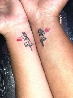 two people with matching tattoos on their arms