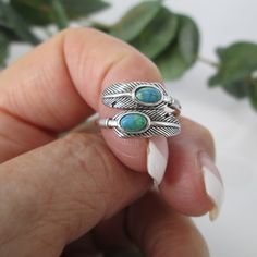 Sterling Feather Turquoise Ring. Native American Sterling Double Feather Ring With 2 Gorgeous Genuine Turquoise Stones. The Turquoise Is Of A Deep Rich Blue Green. The Ring Has Sort Of Wrap Around Design, That Can Be Adjusted A Bit. Great Design, Simple And Oh So Comfortable On Your Finger! Face Height = 11mm. Stamped 925. ***Stones Might Vary A Bit, As Is Expected With Genuine Turquoise. All Are Beautiful. Ref-Sid F48 Adjustable Turquoise Jewelry With Feathers, Feather Ring Silver, Christian Bracelets, Feather Ring, Genuine Turquoise, Wrap Rings, Silver Turquoise, Native American Jewelry, Turquoise Stone