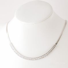 Looking for a statement piece? Look no further than this tennis chain! Made with 4x2mm diamond-shaped cz necklace, this sleek accessory is perfect for adding an elegant touch to any outfit. The adjustable chain makes it easy to customize the length to fit your individual size, and the high quality stainless steel makes it strong and durable. Whether you're hitting the courts or sitting at home watching your favorite shows, this chain will add a bit of sparkle to your day.• Material: High Quality Stainless Steel• Finish: 18K Gold| Stainless Steel• Thickness of the chain 3mm• Featuring a 4x2mm crystals tennis chain with adjustable chain 17 inches to 19 inches