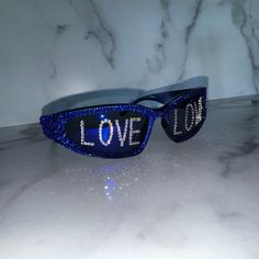 Love Crystal Sunglasses, Mirror lens Wrap Around Space Style, Hand Covered with High Quality, Brilliant Sparkling Crystals. Personalized with the word LOVE on each lens in silver clear diamond crystals.  These on trend, italian style sunglasses come in many color options. Pleases see listing picture and variations at check out to select the color of your choice. Further personalization:  I can personalize the lens with initials, frat or sorority names, numbers, symbols or short words. Message me Bling Sunglasses, Rave Fit, Sorority Names, Sunglasses Mirror, Numbers Symbols, Crystal Sunglasses, Space Style, Unique Gift Items, Style Sunglasses