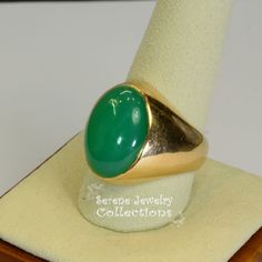 A beautiful simple Chrysoprase cabochon is the centerpiece of this 14k gold ring. It is rare to find chrysoprase in such fine green and even color tone! Ring Size: 9.5 Total Weight: 11.5 grams Precious Metal: 14k Yellow Gold Precious stones: -Chrysoprase Center Stone: 12.2 carats, 18.6mm x 13.3mm Hallmark: 14k Classic Green Oval Opal Ring, Heirloom Green Emerald Oval Cabochon Ring, Heirloom Green Oval Cabochon Emerald Ring, Classic Green Cabochon Emerald Ring, Green Opal Oval Ring In 14k Gold, Heirloom Style Green Emerald Ring With Polished Finish, Heirloom Style Polished Emerald Ring, Classic Green Cabochon Ring, Heirloom Green Oval Cabochon Rings