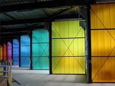 colorful glass doors are lined up against the wall