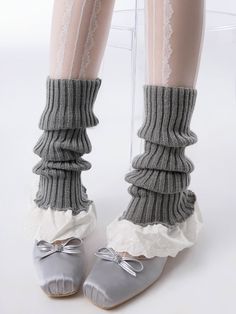 Elevate your outfit with these adorable knitted leg warmers. Perfect for adding a touch of sweetness to any look, these leg warmers feature delicate cotton lace trim and a cozy knit fabric. Embracing the popular Korean fashion style, these leg warmers are a versatile addition to your wardrobe. The flared design adds a playful and feminine touch, making them a perfect match for skirts, dresses, or even shorts.  Please note that this product includes one pair of leg warmers only. Cute Stretch Leg Warmers For Fall, Winter Cotton Stretch Legwear, Soft Cotton Leg Warmers For Fall, Stretch Cotton Leg Warmers For Winter, Gray Knit Bottoms For Winter, Casual Gray Legwear For Winter, Solid Cotton Leg Warmers For Fall, Footless Cotton Leg Warmers For Winter, Cute Fitted Winter Bottoms