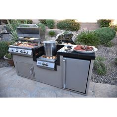 an outdoor bbq grill with various foods on it