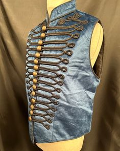 Military Waistcoat Blue Gothic Raven SDL Clothing Steampunk Military style Waistcoat This is a  blue cotton velvet mix waistcoat. It is a military style black braid detail  and rustic  buttons.  This  waistcoat is in two sizes  ML chest 40/42" XL chest 44/46" Thank you for looking Blue Buttoned Vest For Fall, Fitted Vest With Buttons For Festival, Fitted Blue Vest With Buttons, Fitted Blue Vest For Festival, Traveler Outfit, Gothic Raven, Gothic Steampunk, Black Braids, Military Style