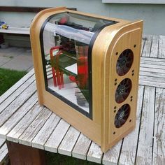 a computer case sitting on top of a wooden bench