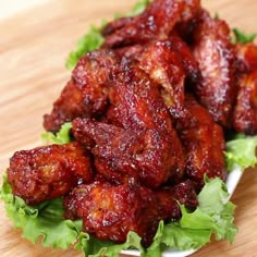 closeup of chicken wings with lettuce on the side