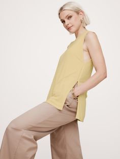 An invitation to play with proportions, this summer-ready tank is cut in a longer length, offset with high slits at the side seams.  For fabric, we reached for one of our softest ribbed knits.  Relaxed fit.  Tunic length.  Crew neck.  Straight hem with high side slits.  Relaxed fit.  Sleeveless.  Tunic length.  Model: Size S, 5'10" (178cm). Invitation To Play, Butter Yellow, Sleeveless Tunic, Summer Ready, Tunic Length, Long Length, Womens Clothing Tops, Banana Republic, To Play