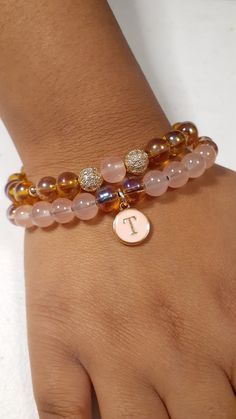 Initial T bracelet set, comes with two bracelets. One incudes a initial charm. Trendy Personalized Rose Gold Bracelets, Personalized Rose Gold Trendy Bracelet, Trendy Adjustable Bracelets With Initials, Trendy Initials Bracelet For Gifts, Elegant Rose Gold Bracelet With Letter Beads, Trendy Rose Gold Bracelets With Charms, Trendy Rose Gold Bracelet With Charms, Elegant Adjustable Charm Bracelet With Letter Beads, Adjustable Rose Gold Bracelet With Initials