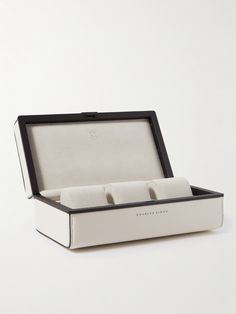 an open watch box with two watches in it