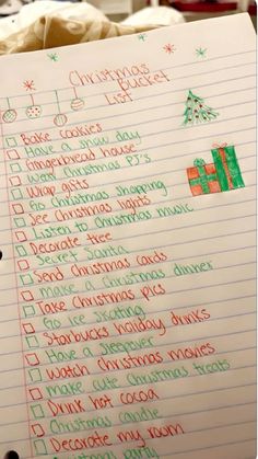 a handwritten christmas list is shown on a piece of lined paper with writing in it