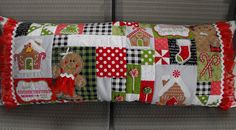 a decorative pillow with gingerbreads and christmas decorations on it