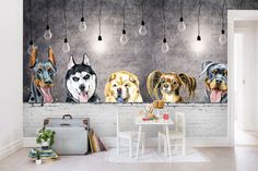 four dogs are hanging on the wall next to a table