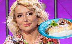 a close up of a person holding a plate with food on it in front of a purple background