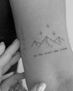 a woman's arm with a tattoo saying to the stars who listen