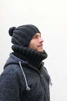 a man wearing a knit hat and scarf