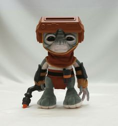 an action figure is posed on a white background in front of a gray and orange backdrop