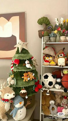 there is a christmas tree that has stuffed animals on it and other toys in the background